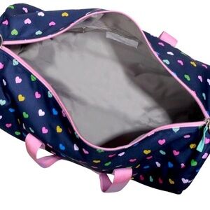 Rolling duffle bag by Pottery Barn Kids for travel.w/ Binder if purchased.